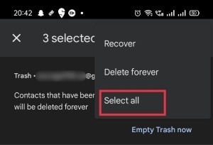 Selecting "Recover" option in Trash folder on Google Contacts app.